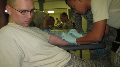 Me giving a saline lock to Senior Airman Boyd